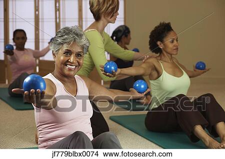 Picture - Multi-ethnic women in exercise class. Fotosearch