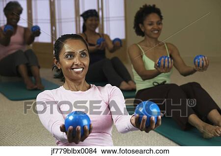 Picture - Multi-ethnic women in exercise class. Fotosearch
