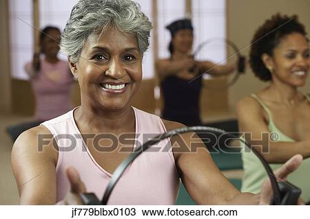 Multi-ethnic women in exercise class View Large Photo Image Stock Image - Multi-ethnic women in exercise class. Fotosearch