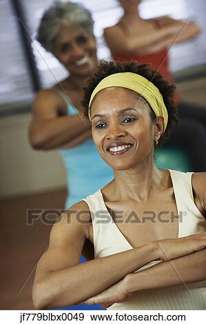 Multi-ethnic women in exercise class View Large Photo Image Stock Photo - Multi-ethnic women in exercise class. Fotosearch
