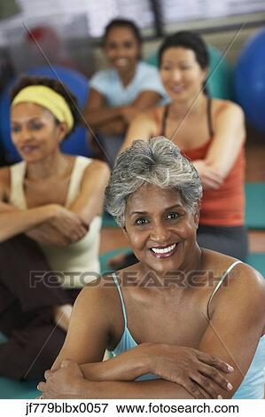 Multi-ethnic women in exercise class View Large Photo Image Stock Photo - Multi-ethnic women in exercise class. Fotosearch