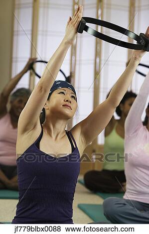 Multi-ethnic women in exercise class View Large Photo Image Stock Photo - Multi-ethnic women in exercise class. Fotosearch