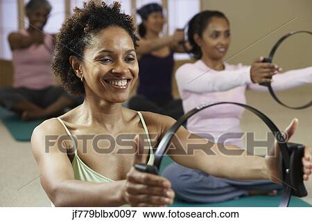 Multi-ethnic women in exercise class View Large Photo Image Stock Photo - Multi-ethnic women in exercise class. Fotosearch