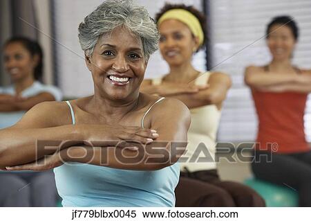 Multi-ethnic women in exercise class View Large Photo Image Stock Photography - Multi-ethnic women in exercise class. Fotosearch