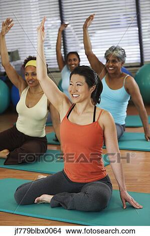 Multi-ethnic women in yoga class View Large Photo Image Picture - Multi-ethnic women in yoga class. Fotosearch