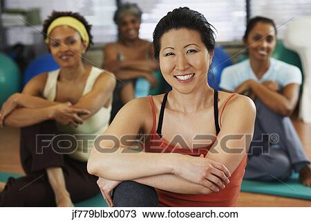 Multi-ethnic women in yoga class View Large Photo Image Stock Image - Multi-ethnic women in yoga class. Fotosearch