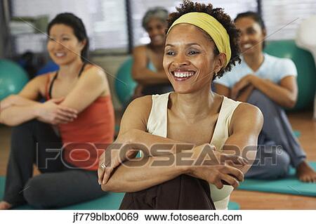 Stock Photo - Multi-ethnic women in yoga class. Fotosearch