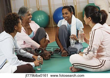 Multi-ethnic women talking at health club View Large Photo Image Stock Image - Multi-ethnic women talking at health club. Fotosearch