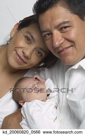Portrait of Hispanic parents and baby View Large Photo Image Stock Photograph - Portrait of Hispanic parents and baby. Fotosearch