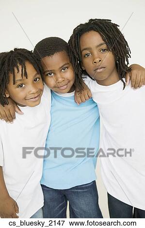 Stock Photo - Three African brothers hugging. Fotosearch