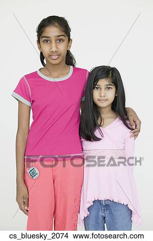 Two Indian sisters hugging View Large Photo Image Picture - Two Indian sisters hugging. Fotosearch