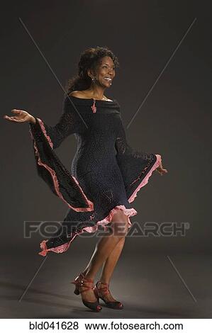 Stock Photo - African American woman dancing. Fotosearch