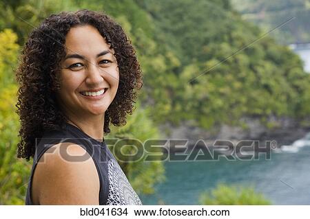African American woman on cliff over water View Large Photo Image Picture - African American woman on cliff over water. Fotosearch