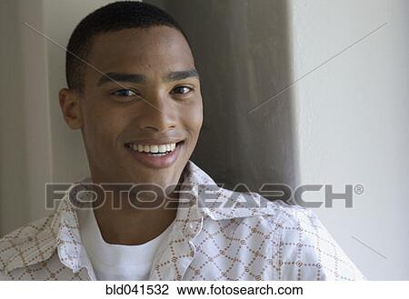 Stock Image - Close up of African man smiling. Fotosearch