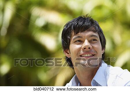 Stock Image - Close up of South American man smiling. Fotosearch