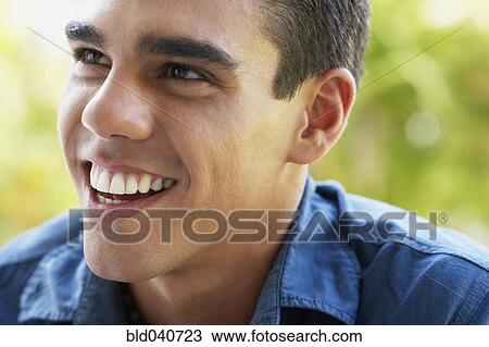 Stock Image - Close up of South American man smiling. Fotosearch