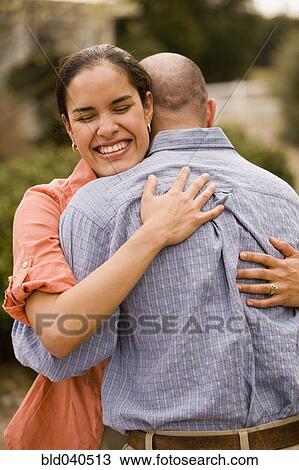Hispanic couple hugging View Large Photo Image Stock Image - Hispanic couple hugging. Fotosearch