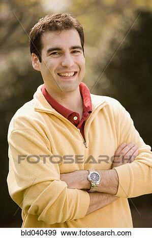 Hispanic man with arms crossed View Large Photo Image Stock Photo - Hispanic man with arms crossed. Fotosearch