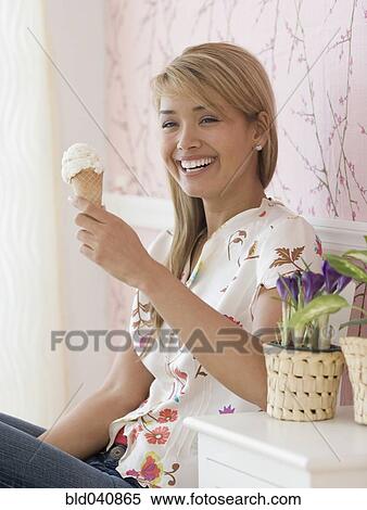 Hispanic woman eating ice cream cone View Large Photo Image Stock Photography - Hispanic woman eating ice cream cone. Fotosearch