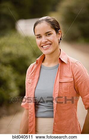Hispanic woman in park View Large Photo Image Stock Image - Hispanic woman in park. Fotosearch