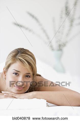 Hispanic woman laying on spa table View Large Photo Image Stock Photo - Hispanic woman laying on spa table. Fotosearch