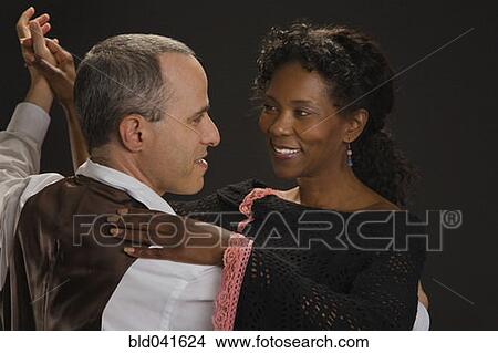 Picture - Multi-ethnic couple dancing. Fotosearch