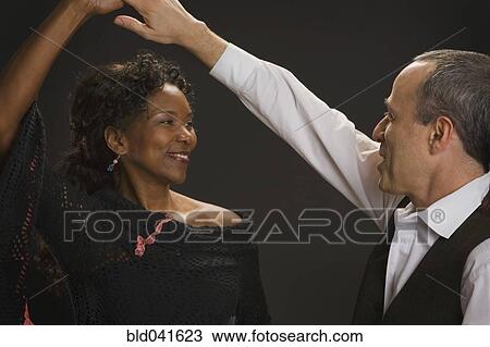 Multi-ethnic couple dancing View Large Photo Image Stock Image - Multi-ethnic couple dancing. Fotosearch