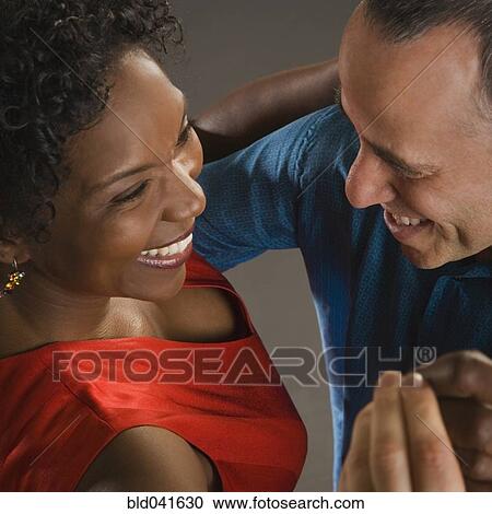 Multi-ethnic couple dancing View Large Photo Image Stock Image - Multi-ethnic couple dancing. Fotosearch