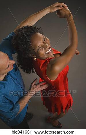 Multi-ethnic couple dancing View Large Photo Image Stock Image - Multi-ethnic couple dancing. Fotosearch