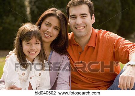 Stock Image - Portrait of Hispanic family outdoors. Fotosearch