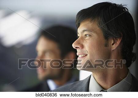 Stock Photograph - South American businessman looking to side. Fotosearch