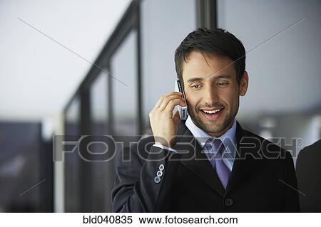 South American businessman talking on cell phone View Large Photo Image Stock Photography - South American businessman talking on cell phone. Fotosearch
