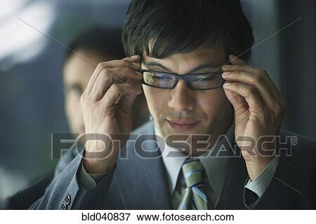 Stock Photo - South American businessman wearing eyeglasses. Fotosearch