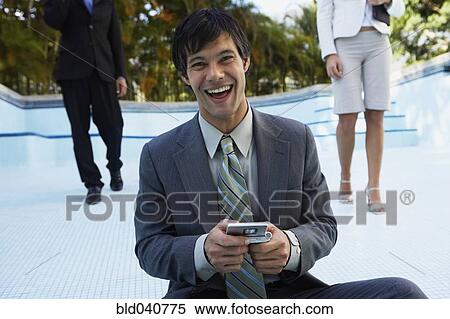 South American businesspeople in empty swimming pool View Large Photo Image Stock Photography - South American businesspeople in empty swimming pool. Fotosearch