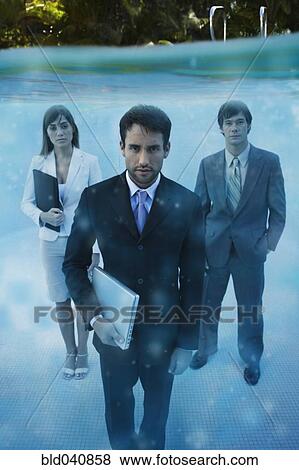 South American businesspeople in swimming pool View Large Photo Image Stock Photo - South American businesspeople in swimming pool. Fotosearch