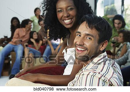 Stock Photo - South American couple at party. Fotosearch