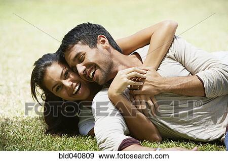 South American couple laying in grass View Large Photo Image Stock Photo - South American couple laying in grass. Fotosearch