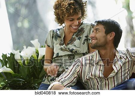 Stock Photo - South American couple smiling at each other. Fotosearch