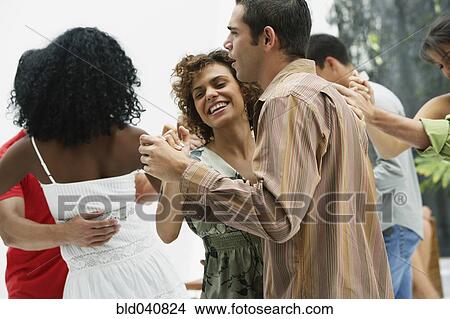 Picture - South American couples dancing at party. Fotosearch