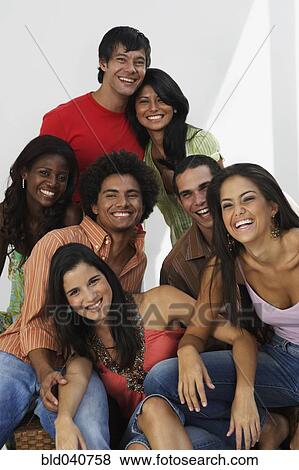 Stock Photo - South American friends laughing. Fotosearch