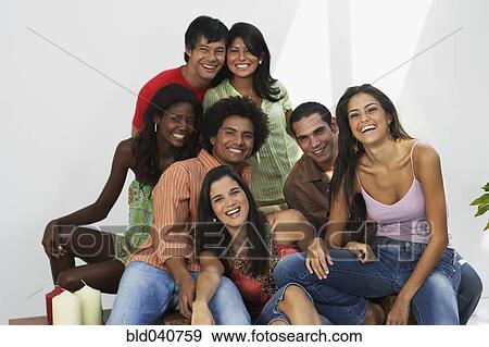 Stock Photo - South American friends laughing. Fotosearch