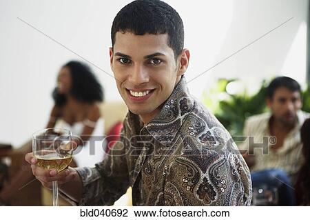 South American man holding wine View Large Photo Image Stock Image - South American man holding wine. Fotosearch