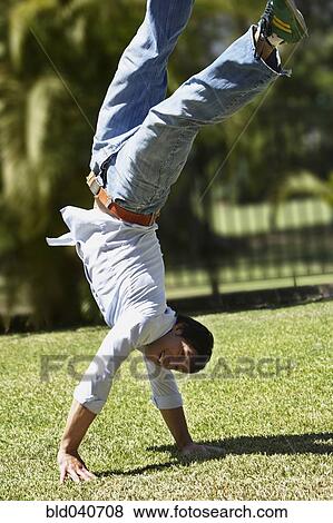 South American man walking on hands View Large Photo Image Stock Photo - South American man walking on hands. Fotosearch