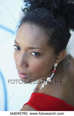 Stock Photography - South American woman looking over shoulder. Fotosearch