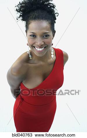 Stock Image - South American woman wearing evening dress. Fotosearch