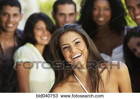 South American woman with friends in background View Large Photo Image Stock Image - South American woman with friends in background. Fotosearch