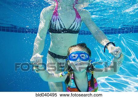 Underwater shot of Asian mother and daughter View Large Photo Image Stock Photography - Underwater shot of Asian mother and daughter. Fotosearch
