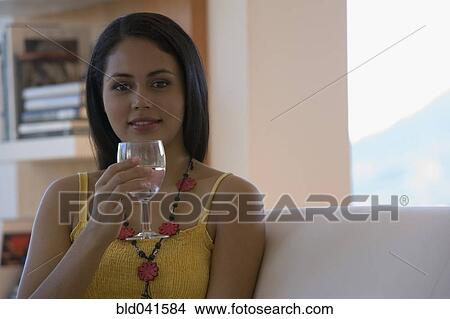 Picture - Young woman drinking wine. Fotosearch