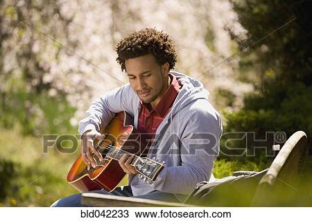 African American man playing acoustic guitar View Large Photo Image Stock Image - African American man playing acoustic guitar. Fotosearch