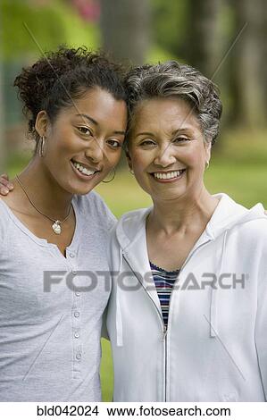 African American mother and adult daughter hugging View Large Photo Image Picture - African American mother and adult daughter hugging. Fotosearch